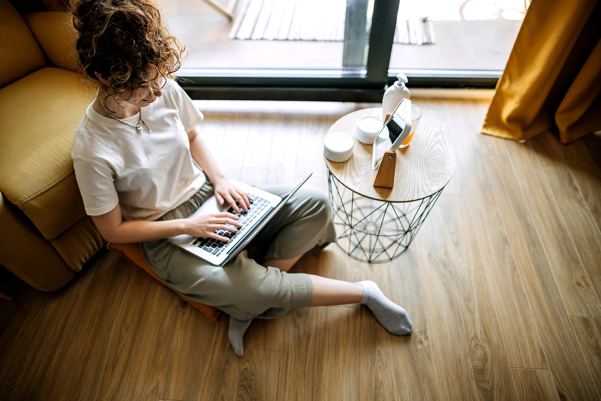 person with laptop sitting down